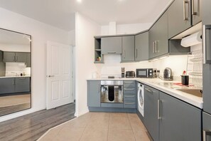 Fridge, microwave, oven, stovetop - Modern 1-bed apartment in Belfast’s Cathedral Quarter. (Belfast)