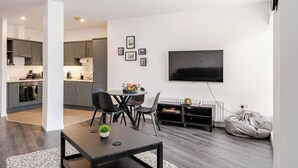 A modern apartment with a dining area, kitchen, and living room. - Modern 1-bed apartment in Belfast’s Cathedral Quarter. (Belfast)