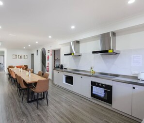 Fridge, microwave, oven, stovetop - 102 Luxury Queen Room with Hotel Experience • Fast WiFi • Close to Tram, 18 mins to CBD • 24/7 Security (Brunswick East)