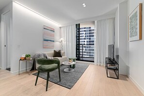 TV - Designer Dream: Wellness Spa & City Living | 1BR Melbourne CBD Retreat | Balcony Views | Pool, Gym, Sauna | Free Tram Zone | Steps to Market & Station (Melbourne)