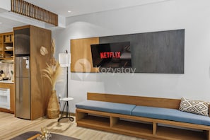 Apartment, 1 Bedroom, Pool View | Living area | 43-inch Smart TV with cable channels, Netflix, streaming services