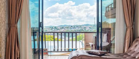 Deluxe Room, Pool View | Blackout drapes, free WiFi, bed sheets