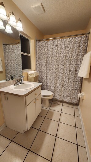 Shower, hair dryer, towels, soap