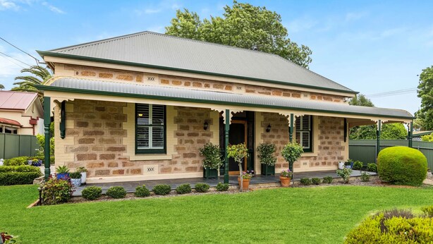 A two-story stone house with a gabled roof, a front porch, and a picket fence. - "GraciaDeDios" Beautifully renovated 1910 Cottage (Mount Barker)