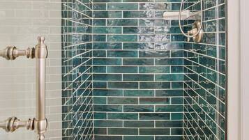 Shower, hair dryer, towels, shampoo