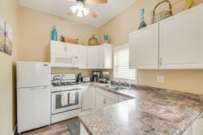Fridge, microwave, stovetop, coffee/tea maker