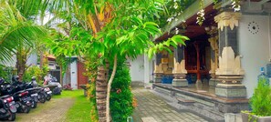 A traditional building with a porch, stone pillars, and a clock on the wall. - Aleenka House 1
A quite home with a super comfortable bed (Bali)