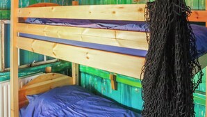 A bunk bed with a wooden frame and a blue mattress.
