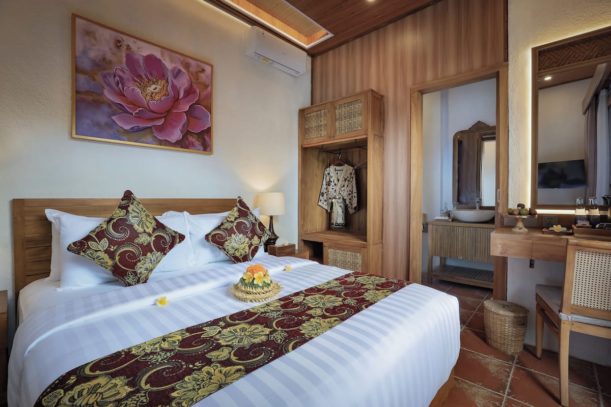 Tabla de planchar con plancha, wifi gratis y ropa de cama
