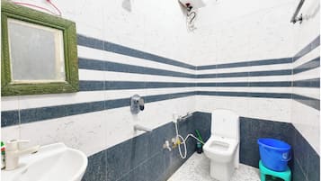 Shower, rainfall showerhead, bidet, towels