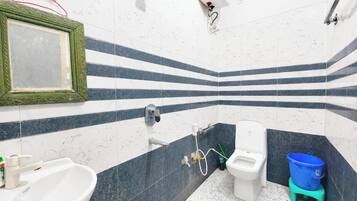 Shower, rainfall showerhead, bidet, towels