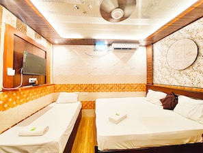 Deluxe Triple Room, City View | Hypo-allergenic bedding, desk, free WiFi, bed sheets