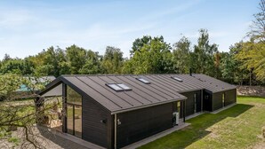 A modern, two-story building with a flat roof and large windows. - "Zoya" -  from the sea by Interhome (Hals)