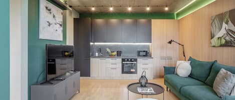 Comfort Apartment, City View | Private kitchen | Electric kettle, griddle, cleaning supplies, dining tables