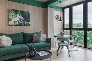 Comfort Apartment, City View | Living area | 37-inch TV with cable channels - Stylish apartment with a view of Park (Minsk)