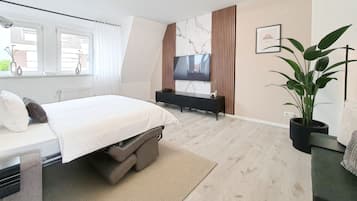 1 habitación, tabla de planchar con plancha, cuna de viaje y wifi