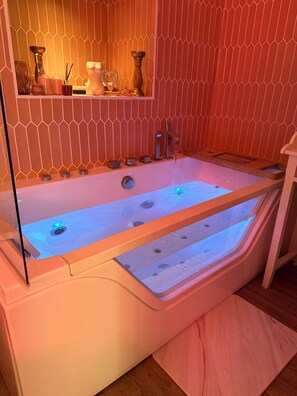 Jetted tub, hair dryer, towels, soap