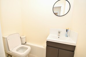 Shower, hair dryer, towels, shampoo