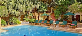 3-Unit Historic Gem | Relaxing Pool, Dining & Central Downtown Vibe