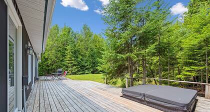 This bright and spacious retreat blends modern comfort with cozy cottage charm. Featuring a fully equipped kitchen, multiple cozy bedrooms, stylish bathrooms, and inviting living spaces with a wood-burning fireplace.