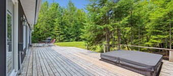 This bright and spacious retreat blends modern comfort with cozy cottage charm. Featuring a fully equipped kitchen, multiple cozy bedrooms, stylish bathrooms, and inviting living spaces with a wood-burning fireplace.