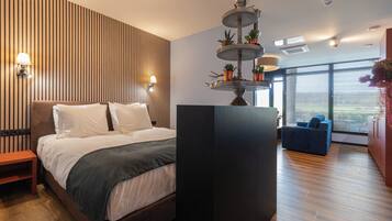 Junior Studio Suite, Patio, Hill View | Premium bedding, in-room safe, laptop workspace, iron/ironing board