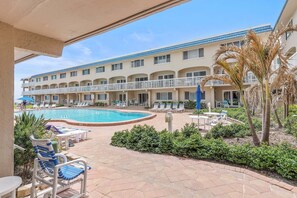 A heated pool - Beachfront Comfort w/ Pool, Patio & Steps to Flagler Avenue (New Smyrna Beach)