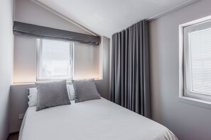 Condo | Rideaux d’obscurcissement, système d’insonorisation