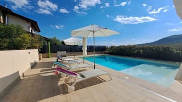 Seasonal outdoor pool, pool umbrellas, pool loungers