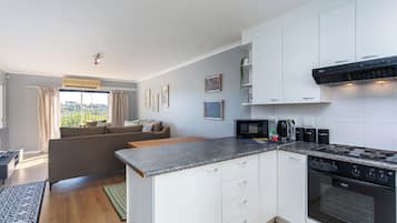 Appartement Confort, patio, vue jardin | Cuisine privée
