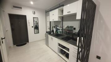 Suite familiare, vista città | Angolo cottura privato