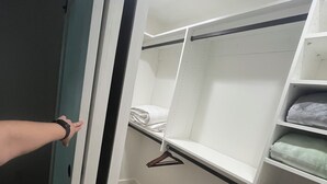 A walk-in closet with open shelves, hanging space, and drawers. - *Just Listed* Alpine Retreat with A/C and hot Tub! (Flagstaff)