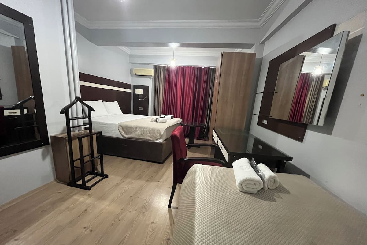 Family Suite, Balcony, City View | Desk, laptop workspace, blackout drapes, iron/ironing board