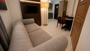 Family Suite, Balcony, City View | Desk, laptop workspace, blackout drapes, iron/ironing board