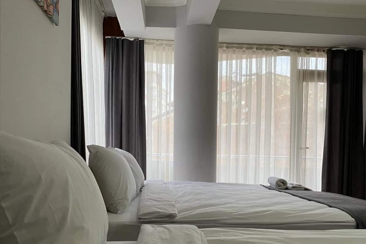 Desk, laptop workspace, blackout curtains, iron/ironing board