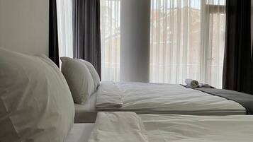 Desk, laptop workspace, blackout curtains, iron/ironing board