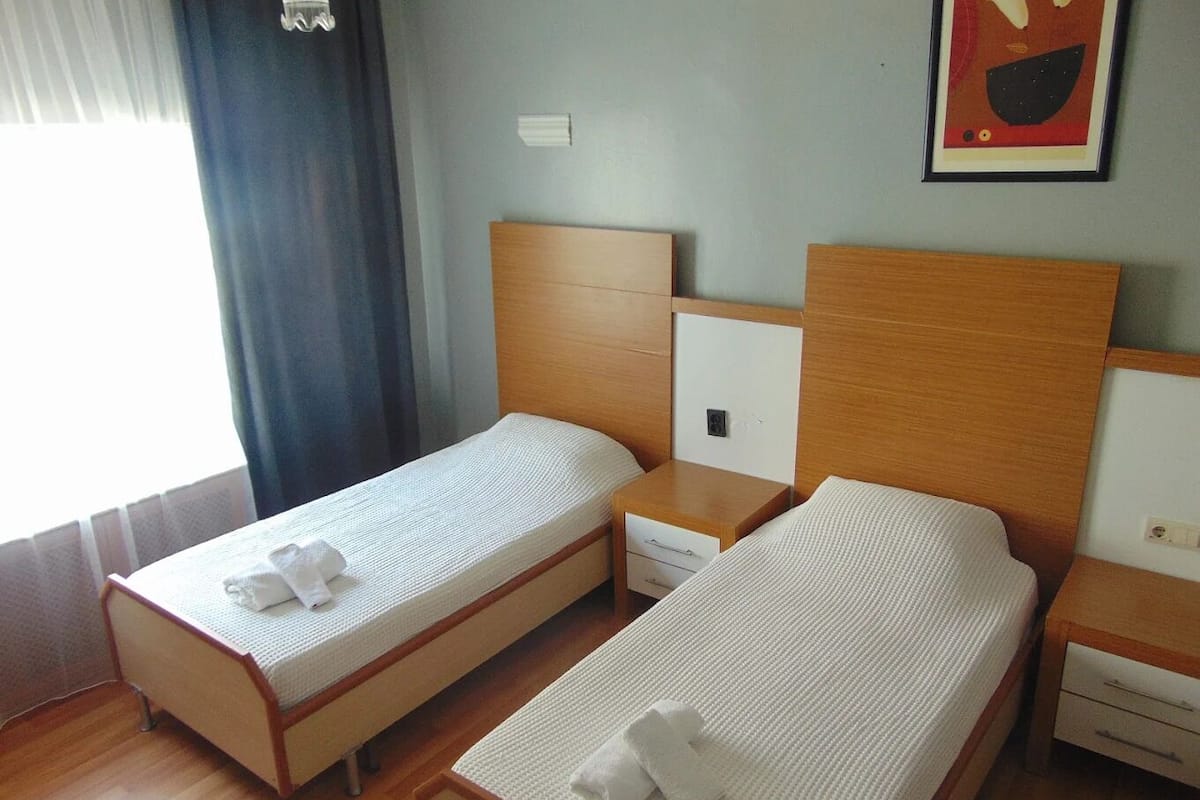 Economy Room | Desk, laptop workspace, blackout drapes, iron/ironing board