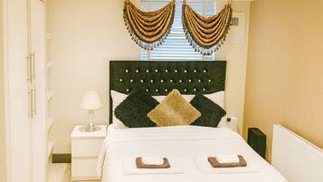 Deluxe Quadruple Room, Courtyard View | Desk, laptop workspace, free WiFi