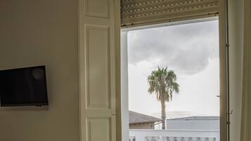 Family Studio Suite, Sea View | In-room safe, laptop workspace, blackout drapes, free WiFi