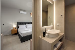 Shower, hair dryer, towels, toilet paper