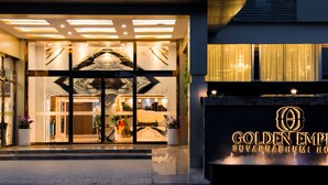 The exterior of the Golden Empire Suvarnabhumi Hotel with a modern entrance, glass doors, and a well-lit facade. - Golden Empire Suvarnabhumi Hotel (Bang Phli)