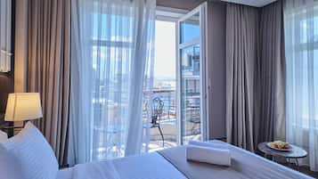 Standard Double Room, Balcony, City View | In-room safe, desk, laptop workspace, iron/ironing board