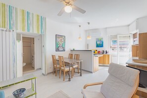 Apartment, 1 Queen Bed with Sofa bed, Sea View | Living area | 30-inch TV with satellite channels