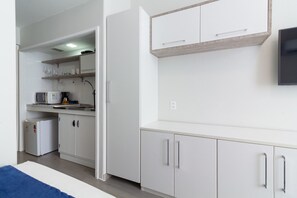 Fridge, microwave, stovetop, coffee/tea maker