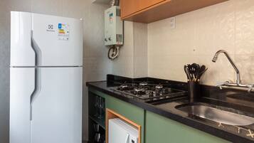 Fridge, microwave, stovetop, coffee/tea maker