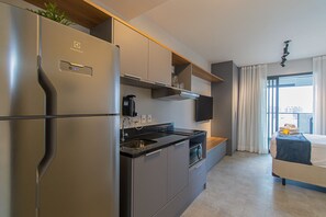 Fridge, microwave, stovetop, coffee/tea maker
