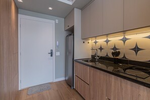 Fridge, microwave, stovetop, coffee/tea maker