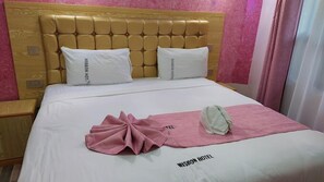 Habitación individual Deluxe, vista a la ciudad | Wifi gratis y ropa de cama 