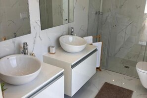 Shower, hair dryer, towels, soap