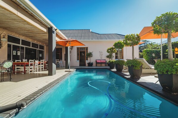 2 outdoor pools, pool umbrellas, pool loungers